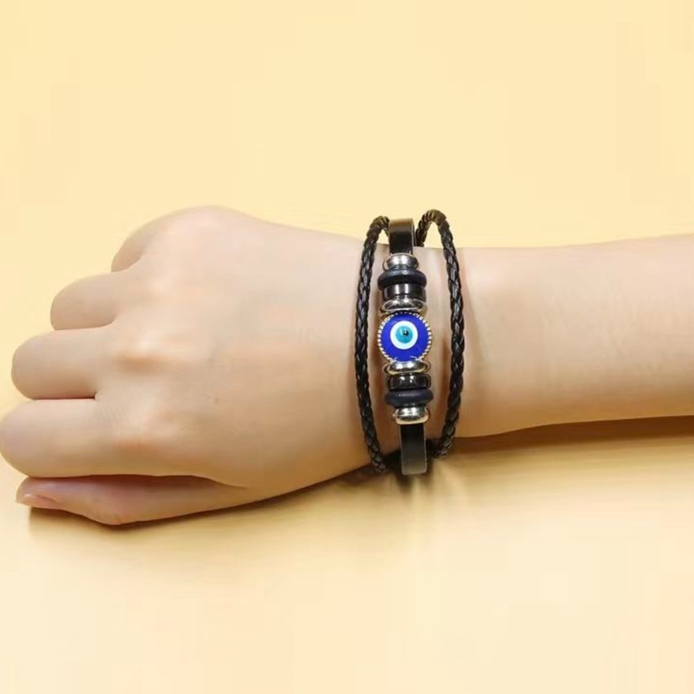 NWOT. UNISEX .Black and Blue Wristband with Eye Design